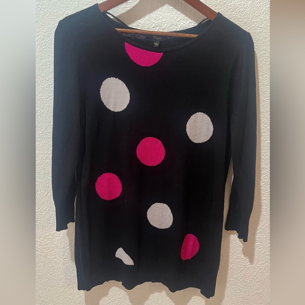 Black sweater with white and pink polka dots